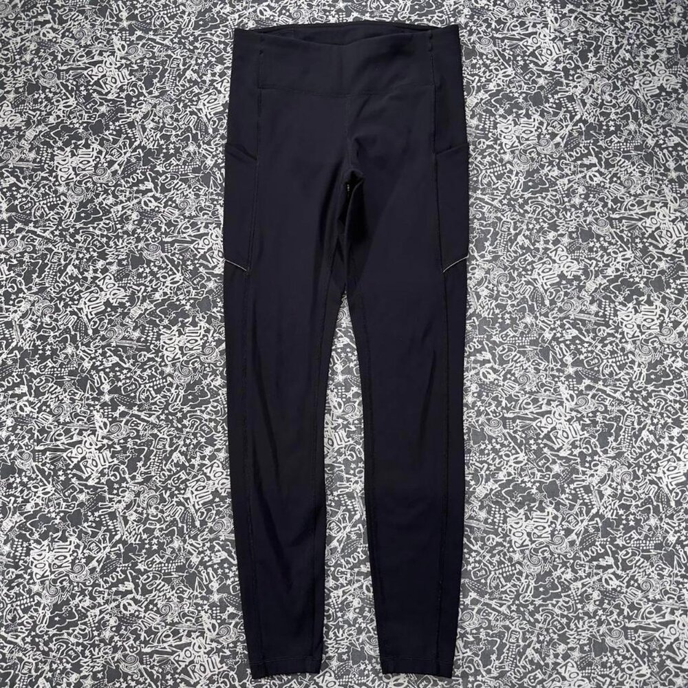 Black Lululemon leggings with mid-rise fit and side pockets - Picture 2 of 7